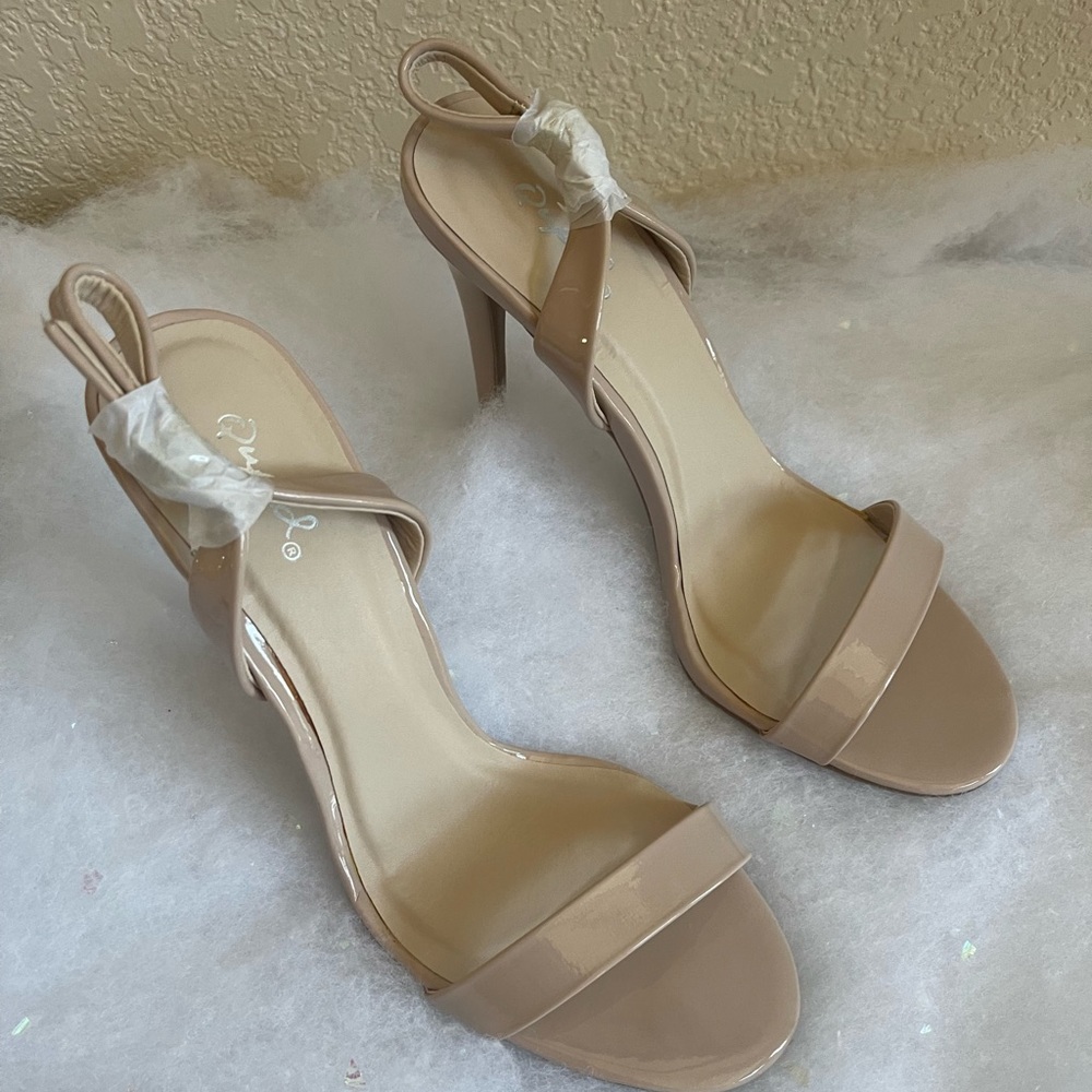 Brand new in box nude heels. Size 8.
